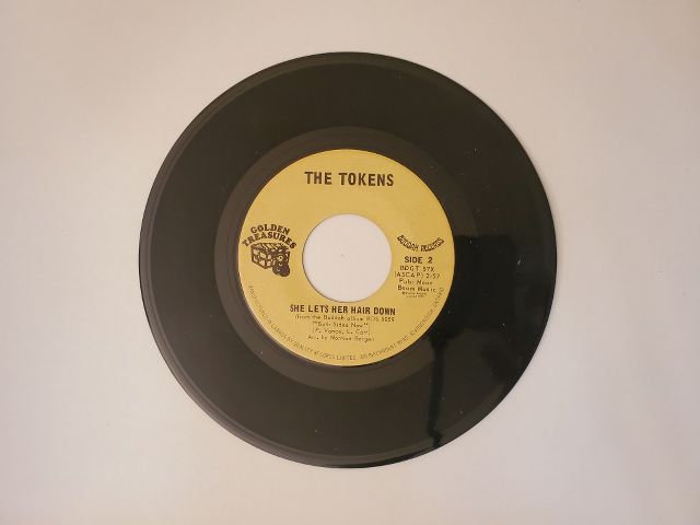 The Tokens She Lets Her Hair Down / The Lion Sleeps Tonight vinyl record
